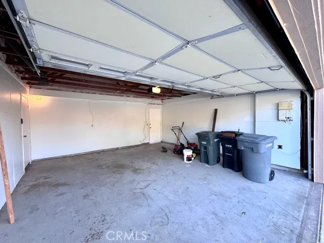 a view of a big room with air conditioner duct and materials on floor