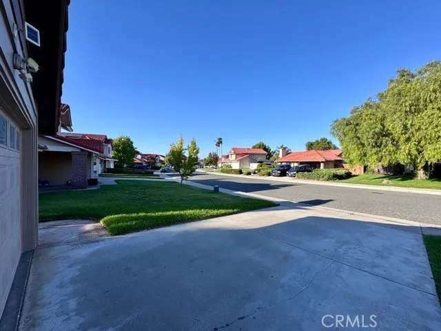 a view of street and trees in the background
