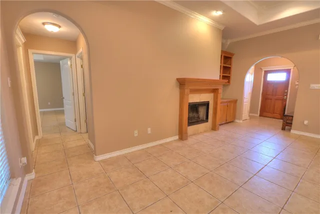 an empty room with windows and entrance