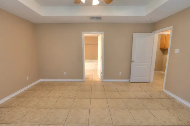 a view of a room with wooden floor and a window