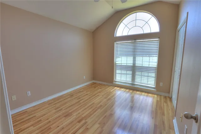 a view of room with window and ceiling fan