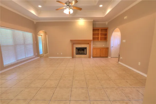 a view of an empty room with a fireplace