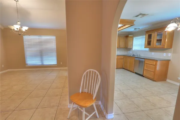 a kitchen with stainless steel appliances granite countertop a sink and cabinets
