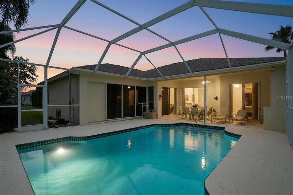 7221 Aloe Drive Spring Hill, FL 34607 - Photo 2 of 34 a swimming pool with outdoor seating yard swimming pool and outdoor seating