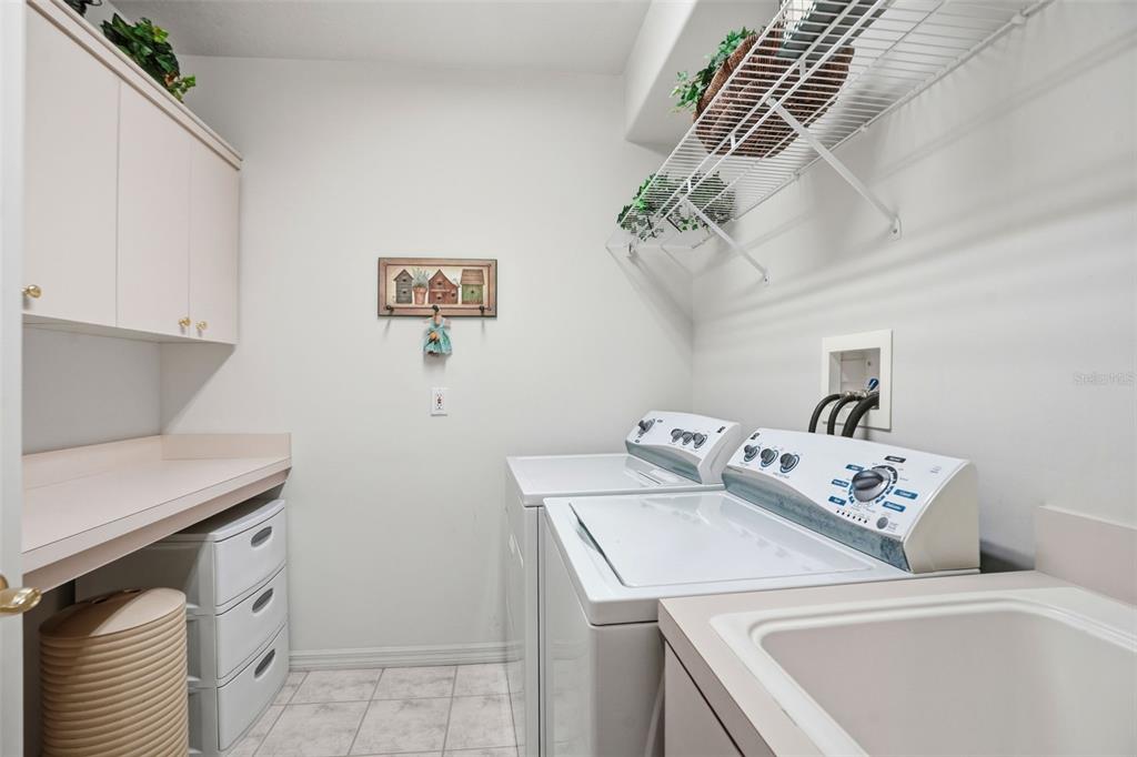 7221 Aloe Drive Spring Hill, FL 34607 - Photo 23 of 34 a utility room with dryer and washer