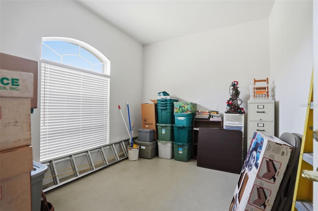 7221 Aloe Drive Spring Hill, FL 34607 - Photo 24 of 34 a view of room with workspace and windows