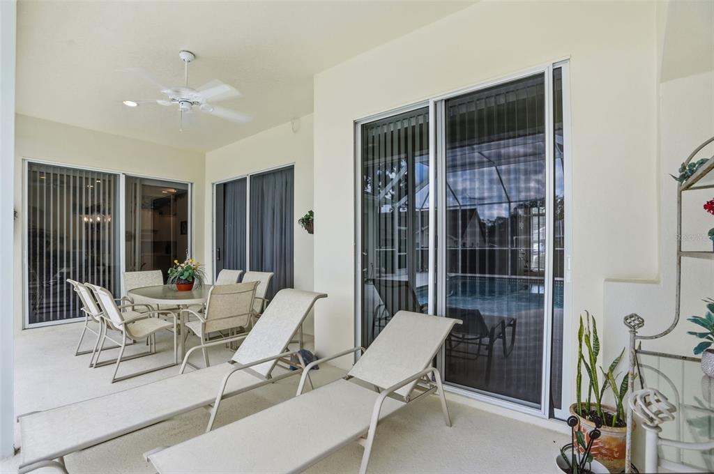 7221 Aloe Drive Spring Hill, FL 34607 - Photo 28 of 34 a view of a livingroom with furniture and floor to ceiling window