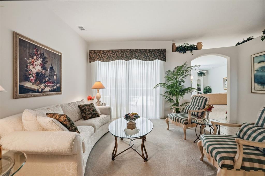 7221 Aloe Drive Spring Hill, FL 34607 - Photo 5 of 34 a living room with furniture and a large window