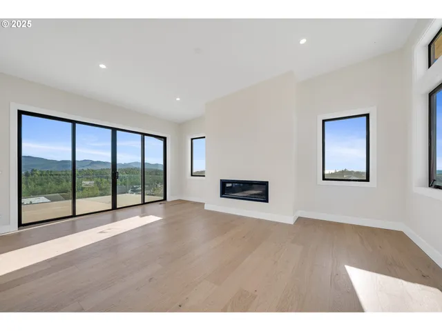a kitchen with a sink a counter top space stainless steel appliances and cabinets