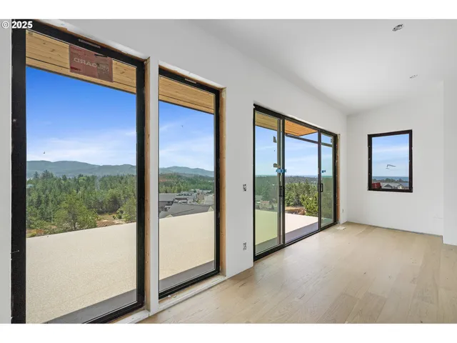 a view of an entryway with wooden floor