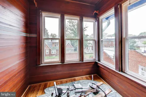 a room with chair and a window