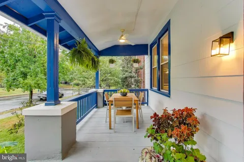 a view of a two chairs in the balcony