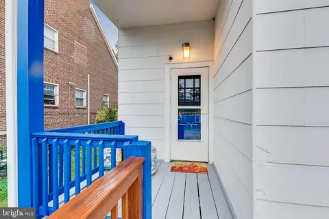 a picture of a bench in front of a wall