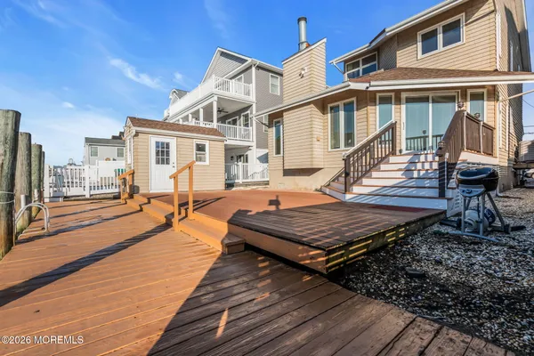 a view of a house with wooden floor and bench