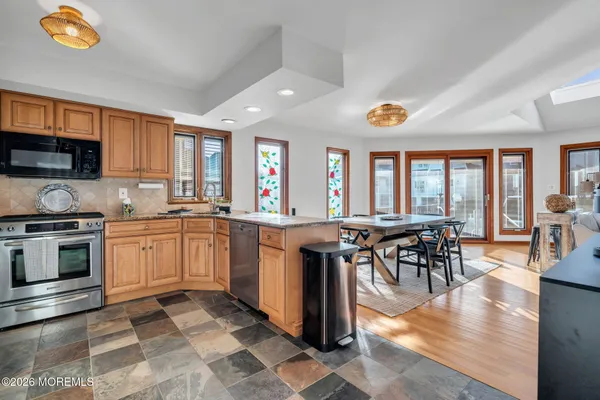 a kitchen with counter top space and appliances