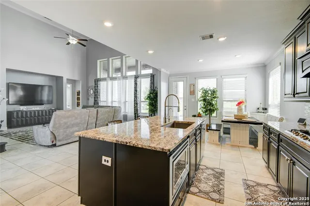 a kitchen with a table and chairs in it