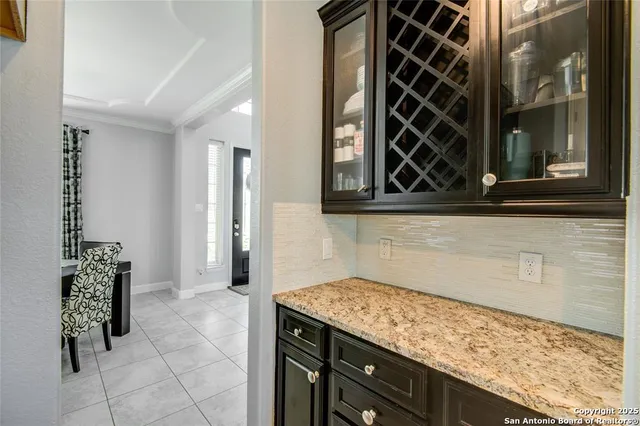 a spacious bedroom with a bed and a potted plant