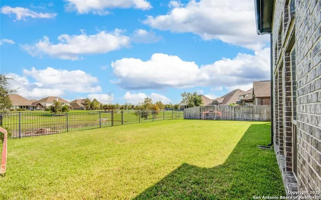 a view of house with swimming pool and porch