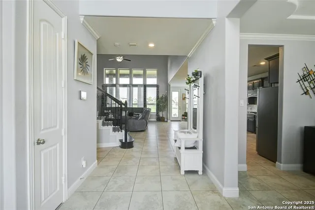 a view of a hallway with living room and bedroom