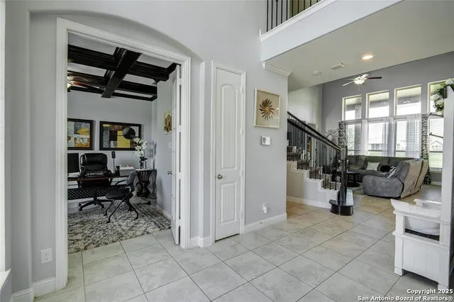 a view of a livingroom with workspace and a window