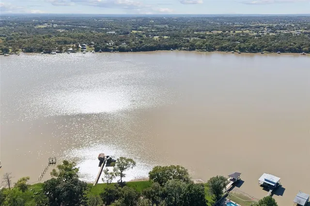 an aerial view of lake and residential houses