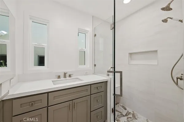 a bathroom with a sink and a mirror