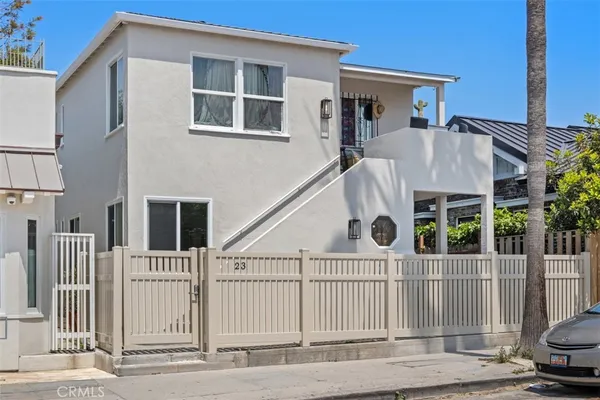 a view of a house with a iron gate