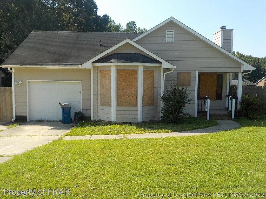 6598 Applewhite Road Fayetteville, NC 28304 - Photo 1 of 9 a view of a house with pool and a yard