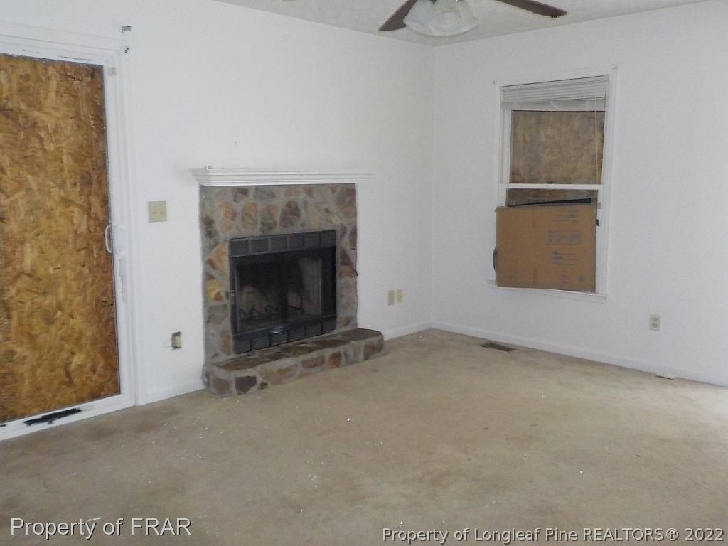 6598 Applewhite Road Fayetteville, NC 28304 - Photo 3 of 9 an empty room with windows