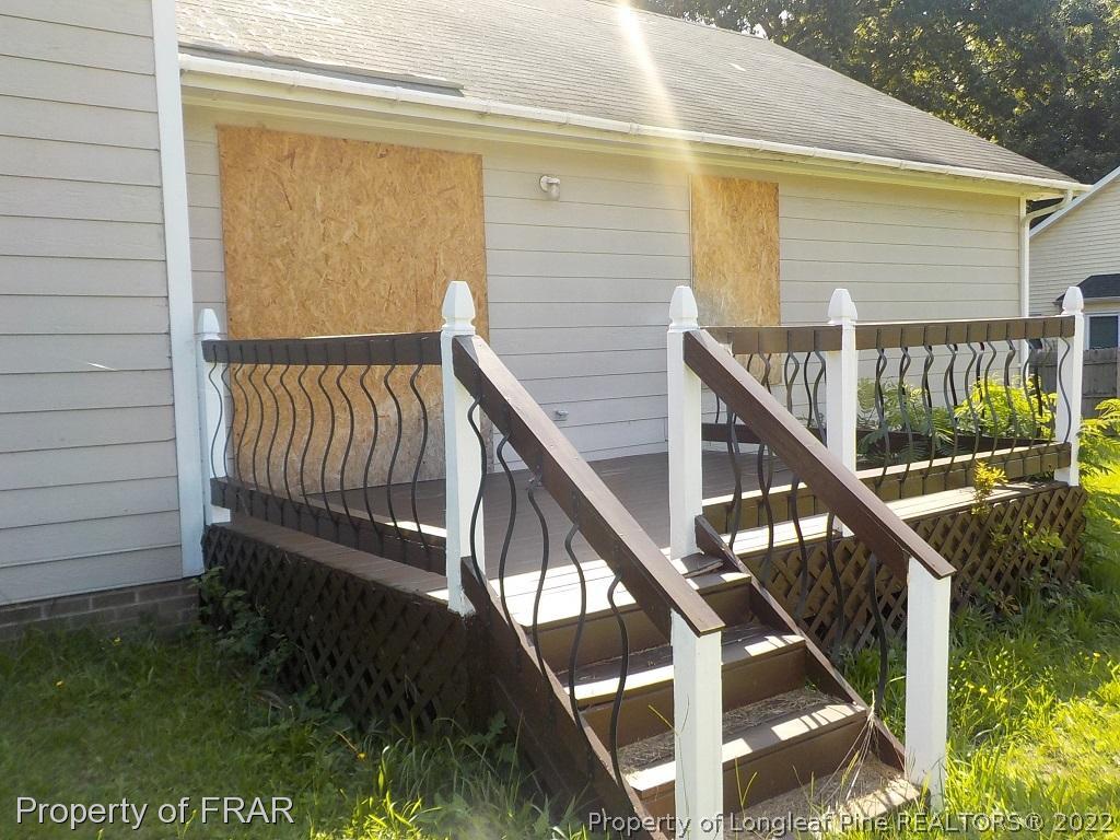 6598 Applewhite Road Fayetteville, NC 28304 - Photo 8 of 9 a view of balcony with wooden floor and fence