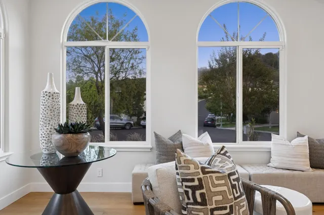 a bedroom with a couch and a potted plant