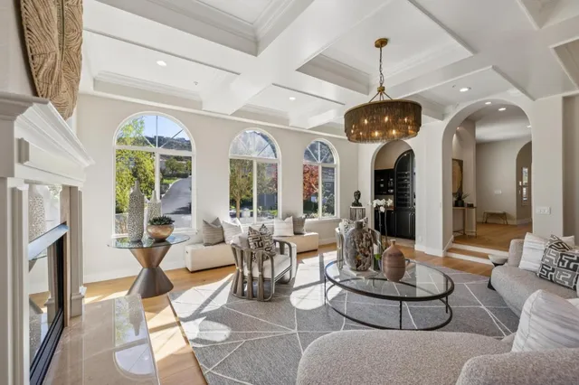 a view of a kitchen with a sink and large window
