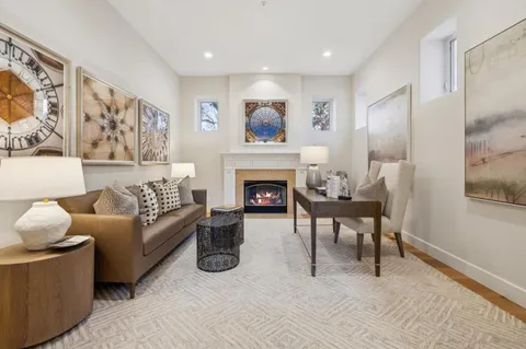 a spacious bedroom with a large bed and a fireplace