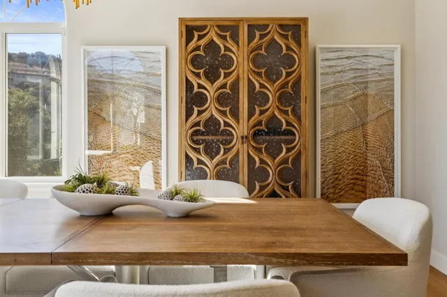 a bedroom with a bed and a view of living room