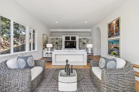 a view of a chairs and table in the balcony