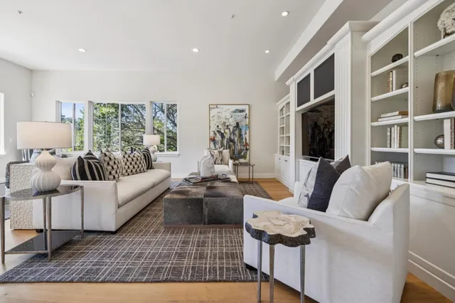a front view of a house with a garden and plants
