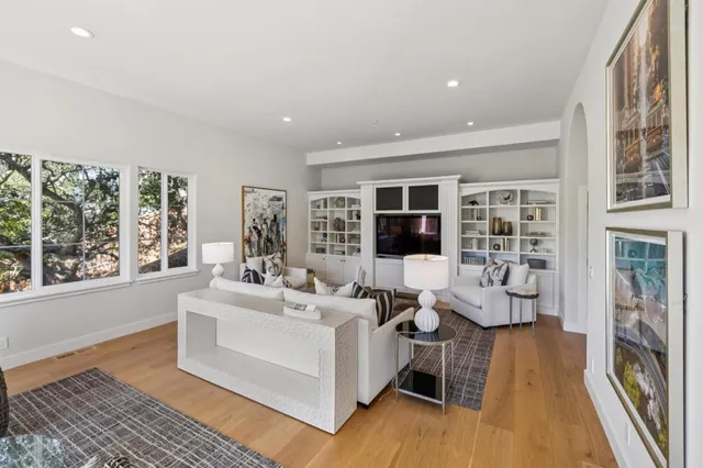 a front view of a house with a garden and yard