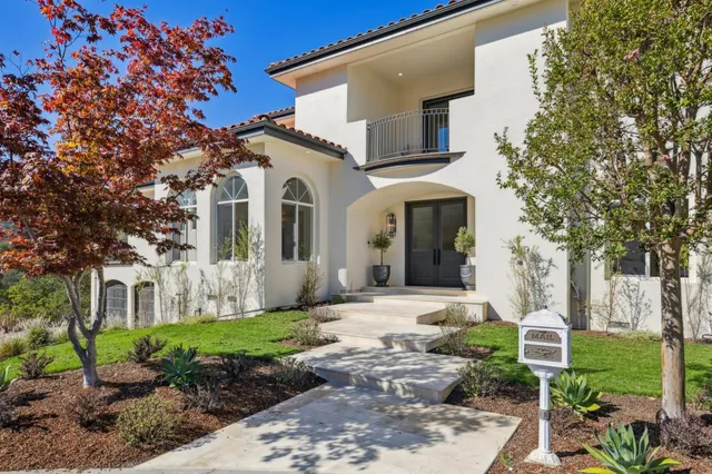 an aerial view of a house with yard swimming pool and outdoor seating