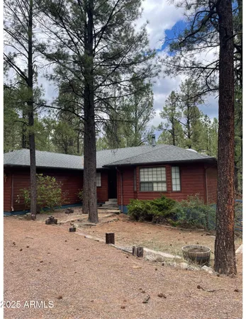 a view of house with yard and outdoor space