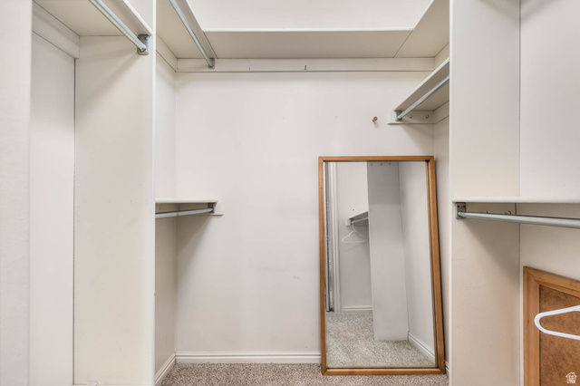 1822 East 9800th Street South Sandy, UT 84092 - Photo 21 of 38 Walk in closet featuring light carpet