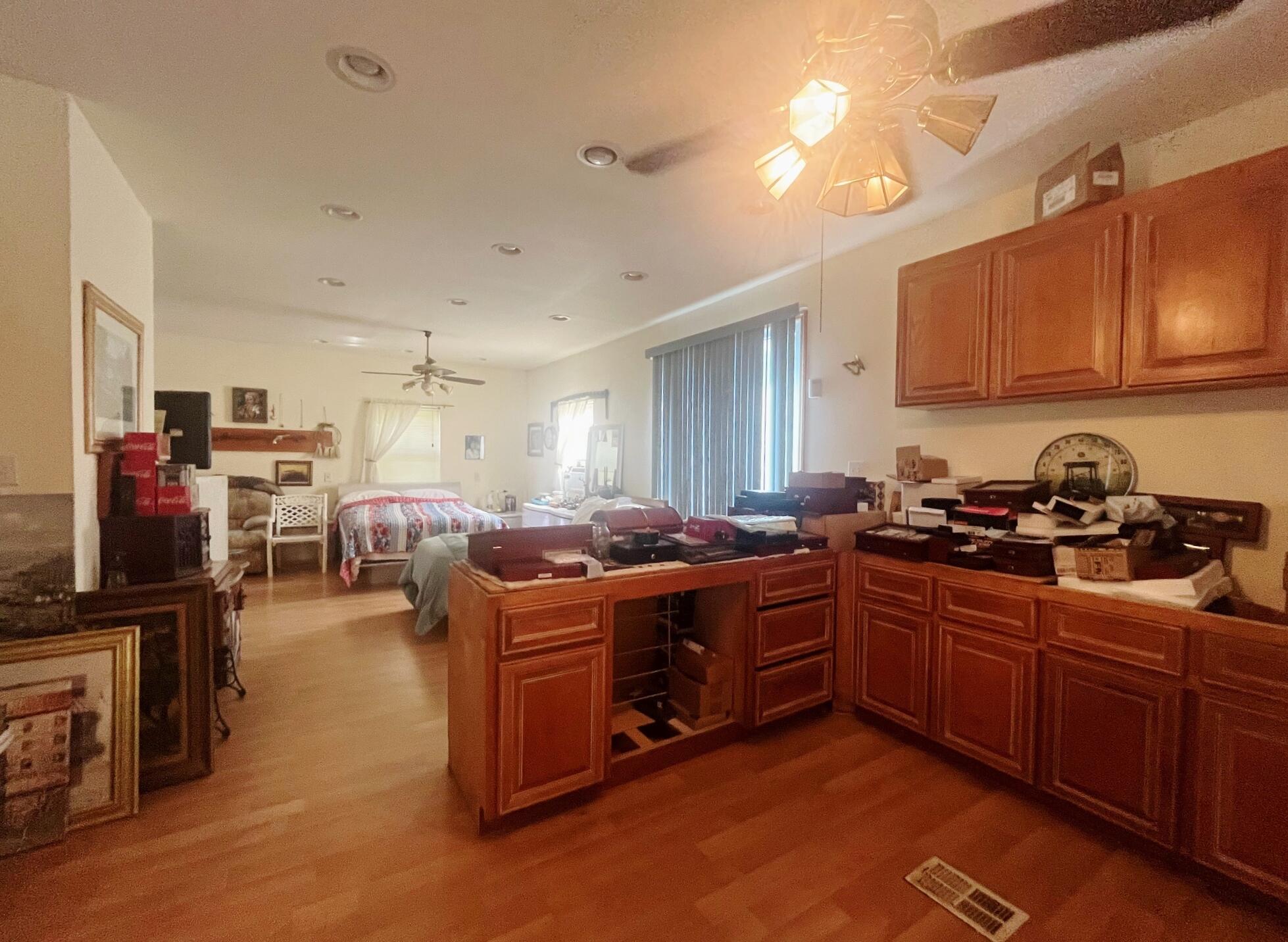58 Hankins Road Freeport, FL 32439 - Photo 14 of 29 a kitchen with stainless steel appliances granite countertop a stove and a sink dishwasher with wooden cabinets