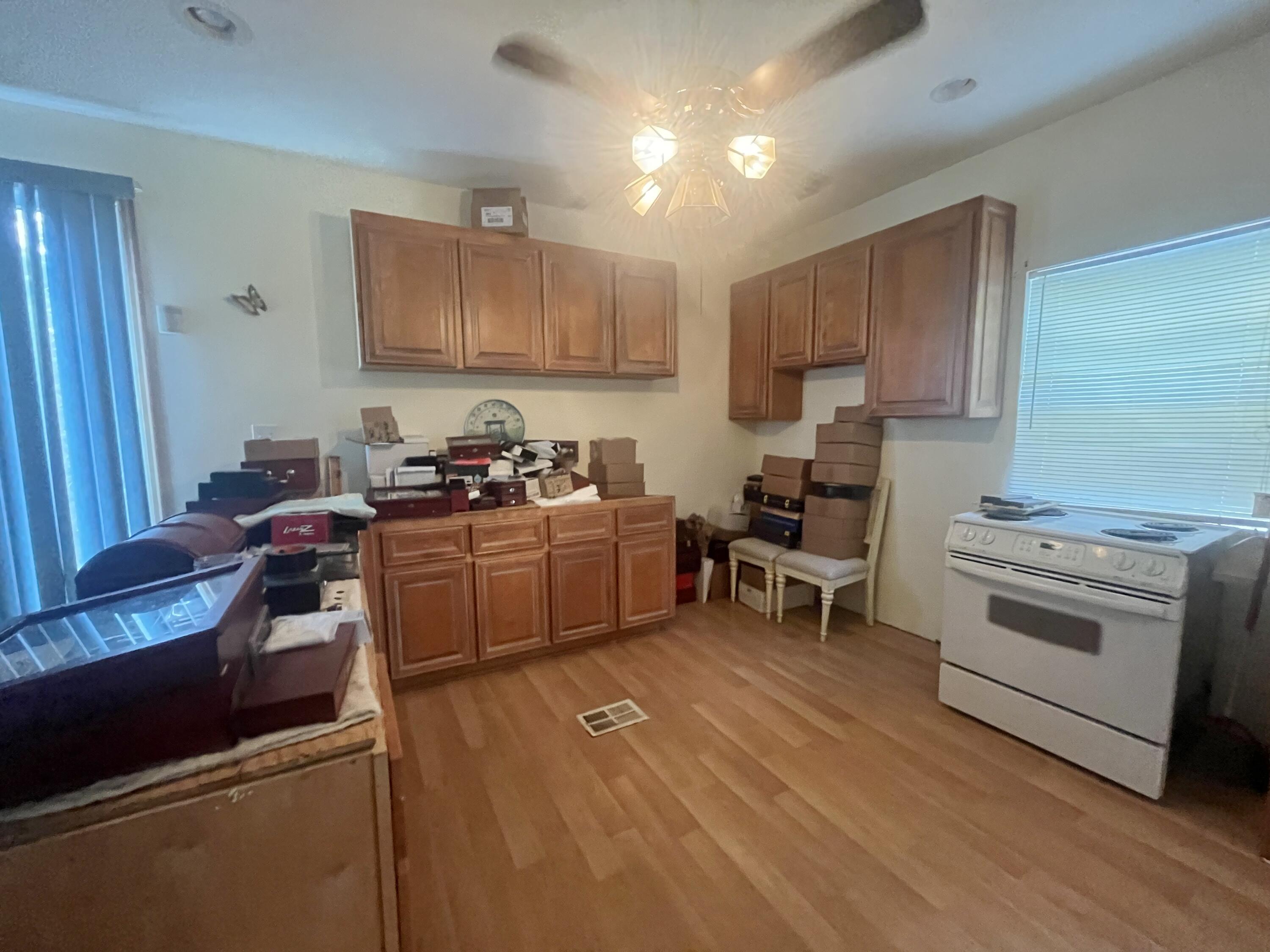 58 Hankins Road Freeport, FL 32439 - Photo 15 of 29 a kitchen with a stove a sink and a refrigerator