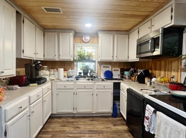 58 Hankins Road Freeport, FL 32439 - Photo 2 of 29 a kitchen with stainless steel appliances granite countertop a sink a stove top oven a counter space and cabinets