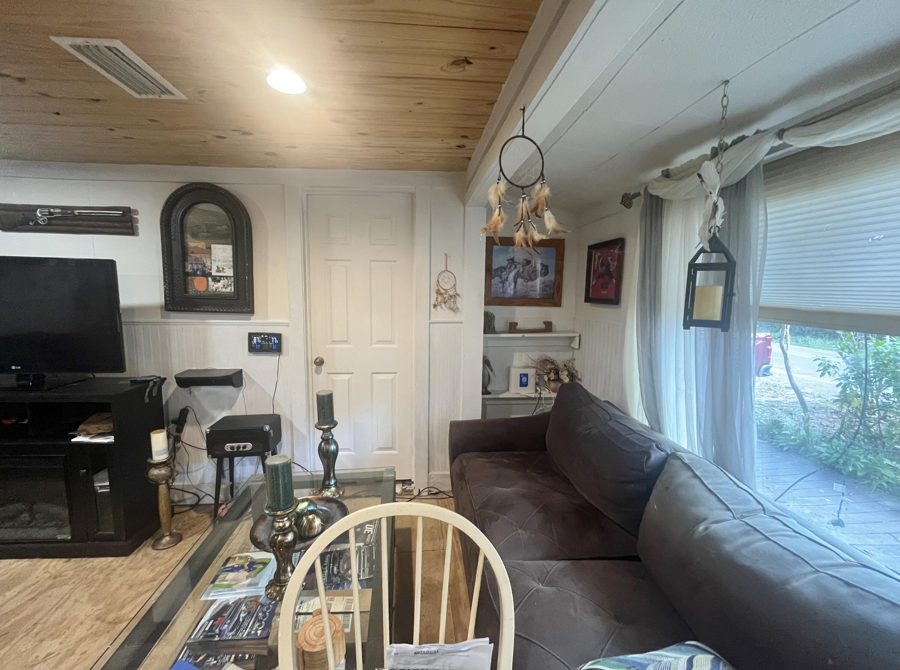 58 Hankins Road Freeport, FL 32439 - Photo 21 of 29 a living room with furniture and a flat screen tv