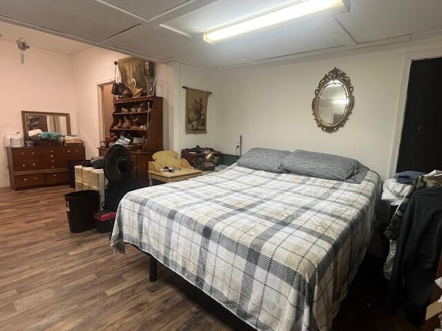 58 Hankins Road Freeport, FL 32439 - Photo 3 of 29 a bedroom with a bed and wooden floor
