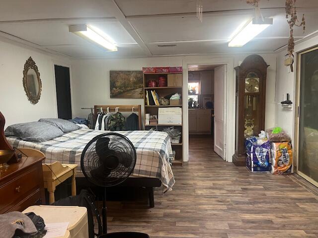 58 Hankins Road Freeport, FL 32439 - Photo 5 of 29 a bedroom with furniture and a wooden floor