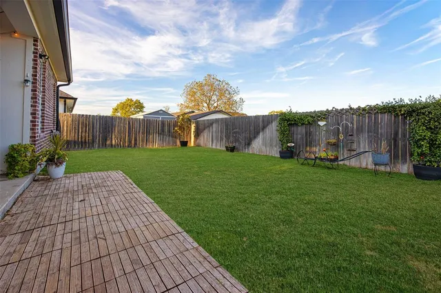 a view of a garden with houses