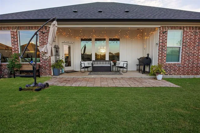 a front view of a house with a patio