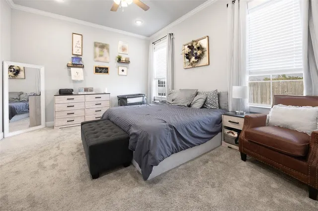 a spacious bedroom with a bed and furniture