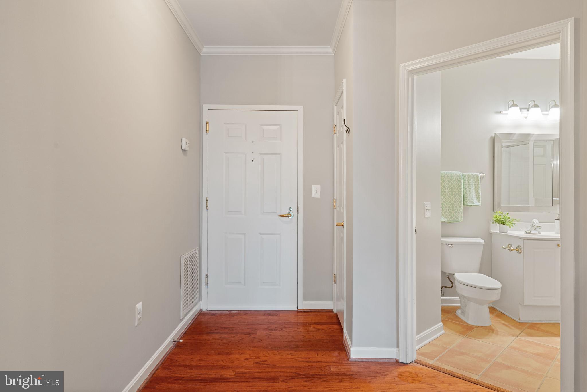 1860 Stratford Park Place, Unit 305 Reston, VA 20190 - Photo 11 of 35 Foyer with hardwood floors